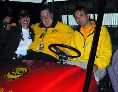 Fellow Burningman EMT and DPW pose with their fire golf cart