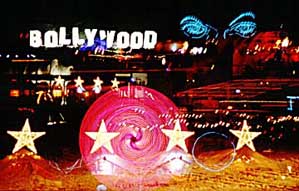 I chose this photo because it is multiple images of the theme camps that surrounded us in 2003, those are our stars, Bollywood was across the street, Eye of Gawd next door, etc., etc., etc