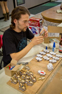 Yakir "Journeyman" Rettig makes illuminated necklaces to gift at the Midburn CORE project