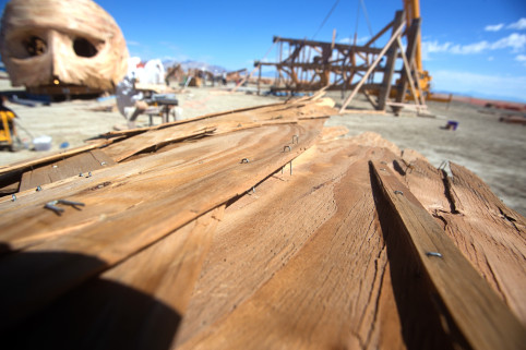 The thin cladding of the "Embrace" project is attached with long staples. As Joe Olivier put it, they would become "fiery butterflies with claws" if the structure burned, so as of now the piece will be disassembled and taken off the playa at the end of the event.