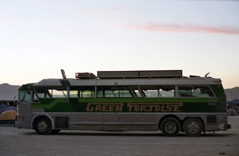Green Tortoise bus on playa (Photographer unknown)
