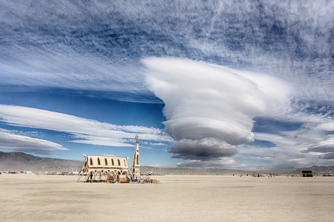 The clouds over the playa, and if someone could help us out with the name of the art piece here, that would be appreciated