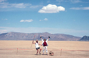 “In 1996, the first trash fence was tested at Burning Man. Concieved by Larry Breed (playa name Ember), several hundred yards of 24" high netting was set up down-wind on the north side of the encampment to catch wind-blown trash. The Black Rock is visible to the right in the background of this photo.” - Danger Ranger (Photo by from Breed’s collection)