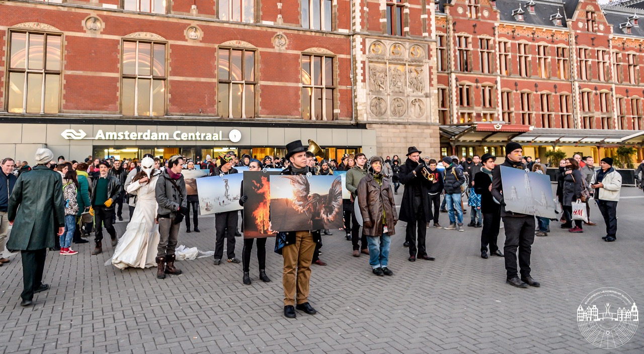 Moving Europe, a series of parades of Burning Man photography through city streets, was kicked off at the European Leadership Summit 2015 in Amsterdam at the Centraal train station and led by Belgian Burner Jan Beddegenoodts. 
