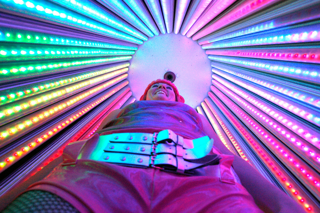 Participant experiencing a spinning cylinder with LED lights