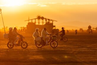 Bikes cruise the playa at sunset (Photo by Espressobuzz)