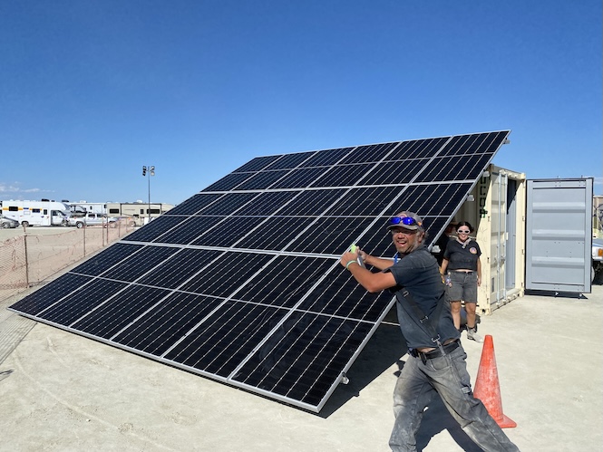 Burning Man Project’s Solar Crew installs the Lean-to solar array to power Black Rock City’s Gate operations, 2023 (Photo Credit: Matthew 'Starchild' Deluge)
