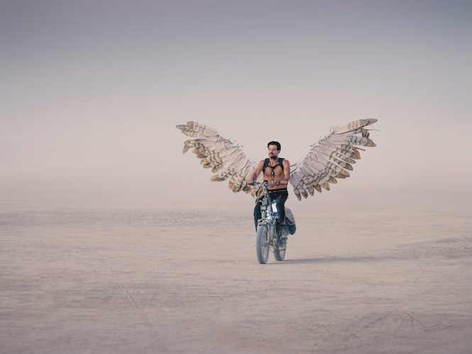 Biker with angel wings and an e-bike (Photo by Scott London)
