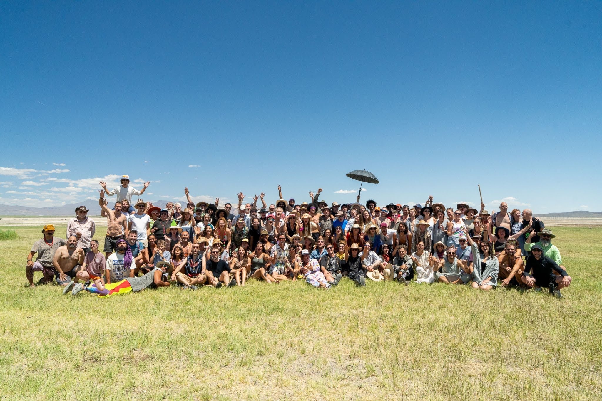 Large group in a green field.